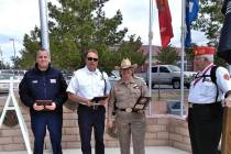 Selwyn Harris/Pahrump Valley Times Pahrump Valley Fire and Rescue Services Scott Lewis, center ...
