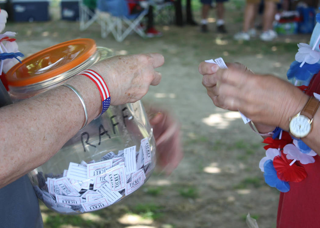 Robin Hebrock/Pahrump Valley Times Raffle tickets were loaded into a plastic jar in preparation ...
