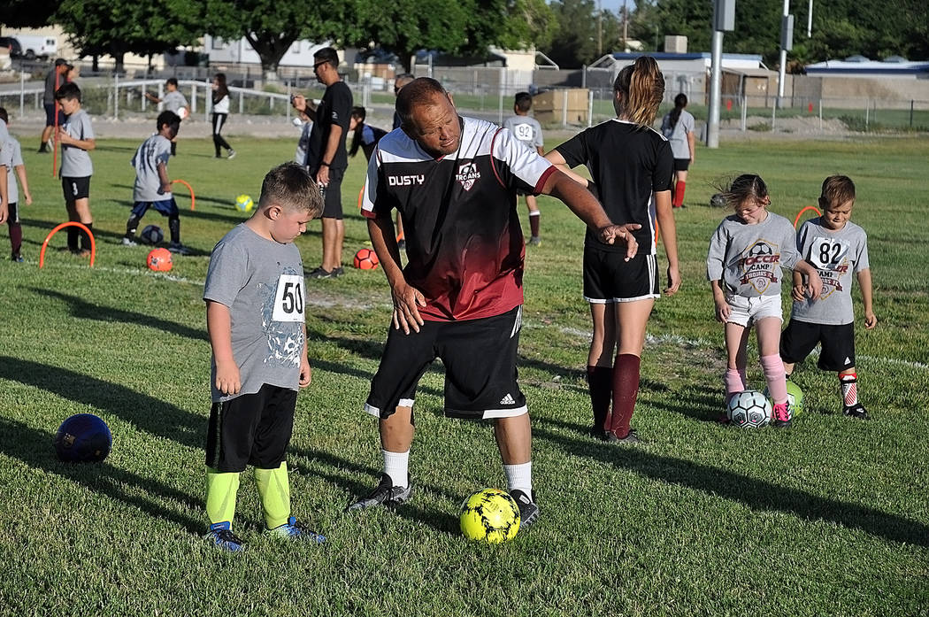 Horace Langford Jr./Pahrump Valley Times Dusty Park gives a prospective soccer player instructi ...