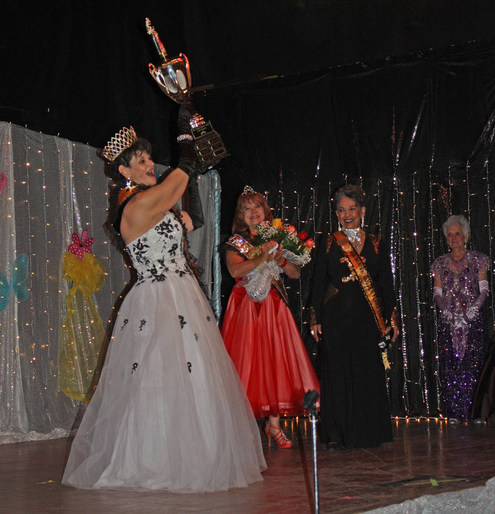 Robin Hebrock/Pahrump Valley Times Laraine Babbitt holds her trophy on high while the audience, ...