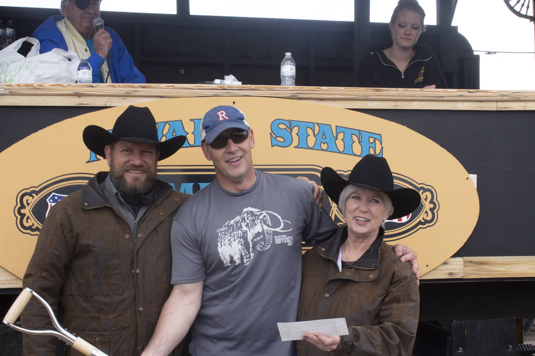 Jeffrey Meehan/Times-Bonanza & Goldfield News Oz Wichman (left) handed out prizes to the winner ...