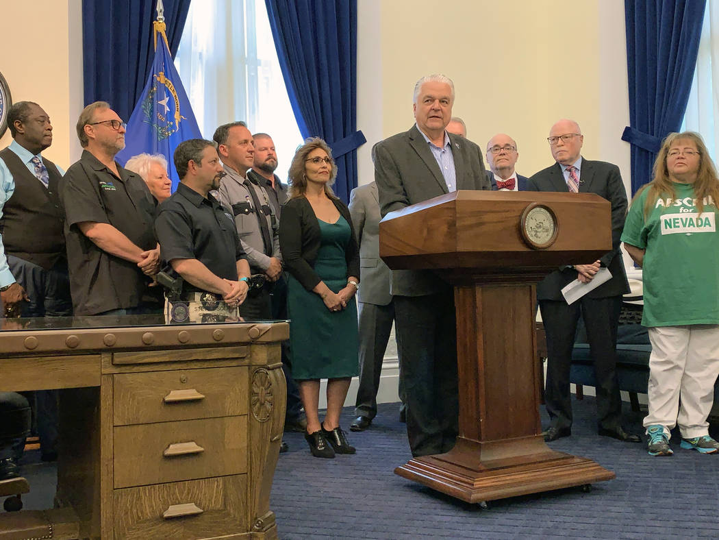 Gov. Steve Sisolak signed a number of bills in Carson City Wednesday including one granting col ...