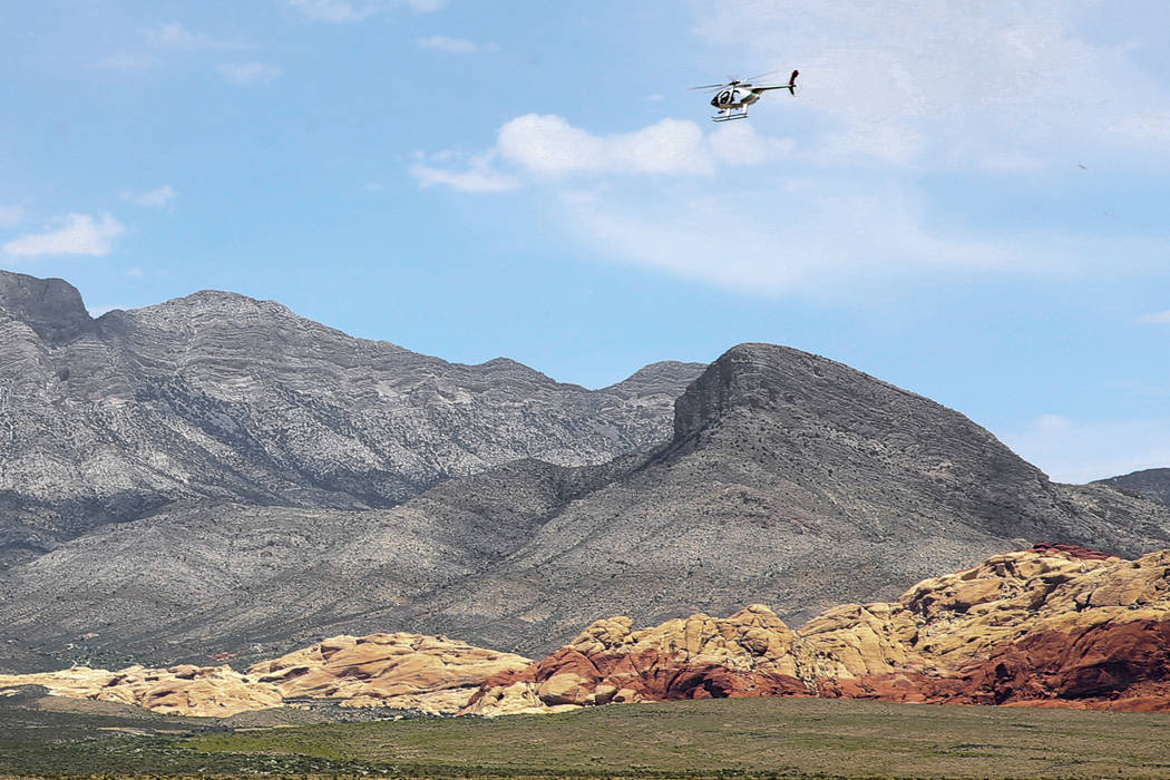 K.M. Cannon/Las Vegas Review-Journal A helicopter flies near the Red Rock Overlook on U.S. High ...