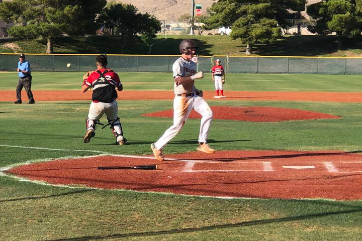 Tom Rysinski/Pahrump Valley Times Pahrump's Chase McDaniel scores on a sacrifice fly by Jake Ri ...