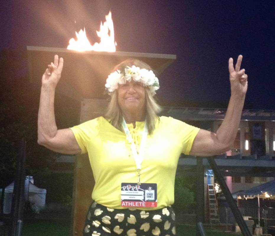 Special to the Pahrump Valley Times Pahrump resident Cathy Behrens in front of the torch that w ...