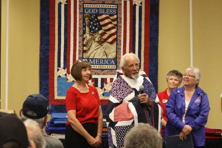 Robin Hebrock/Pahrump Valley Times Veteran Dennis Eggert, surrounded by smiling members of the ...