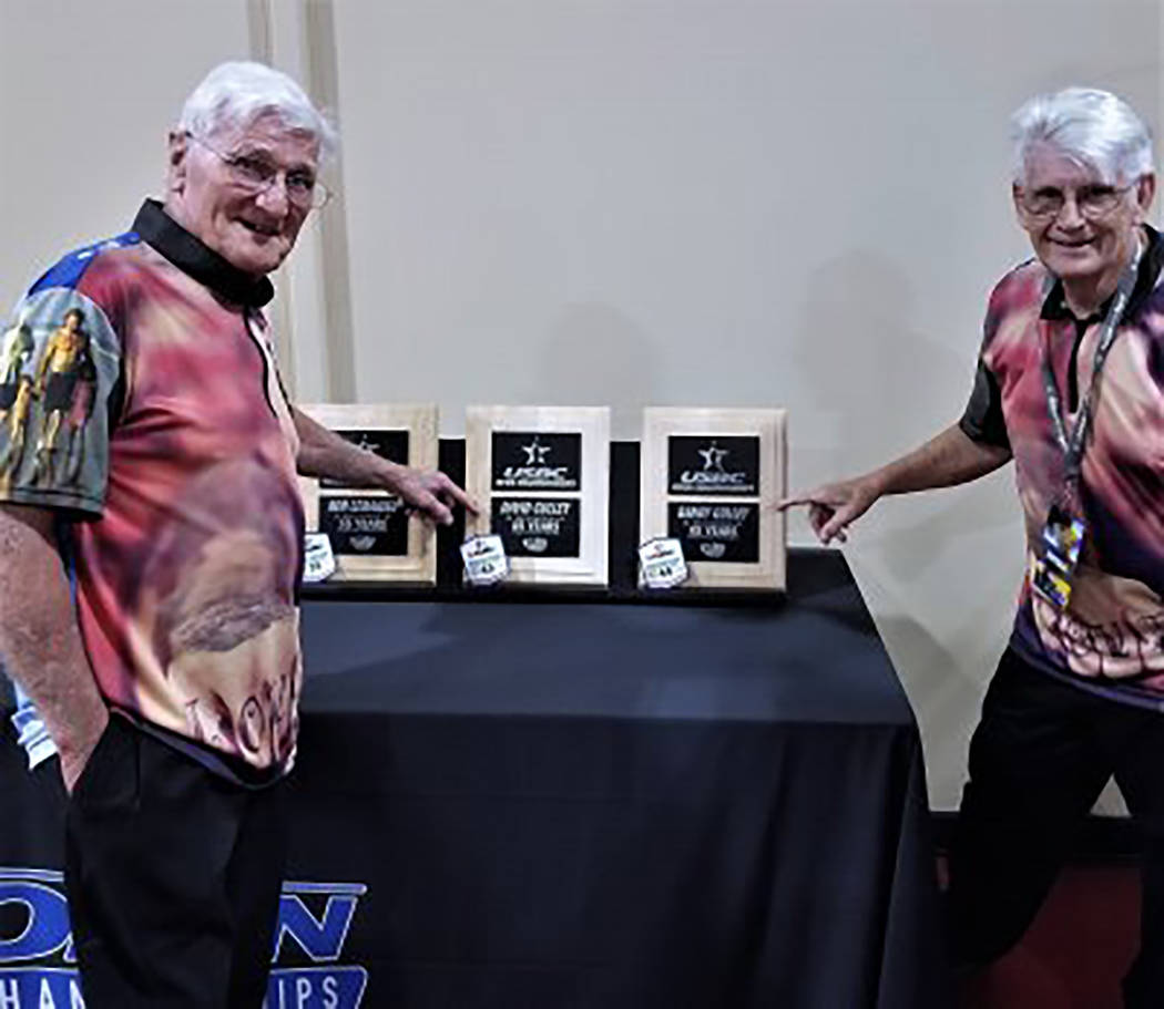 Special to the Pahrump Valley Times David and Randy Gulley point out their plaques for 45 years ...