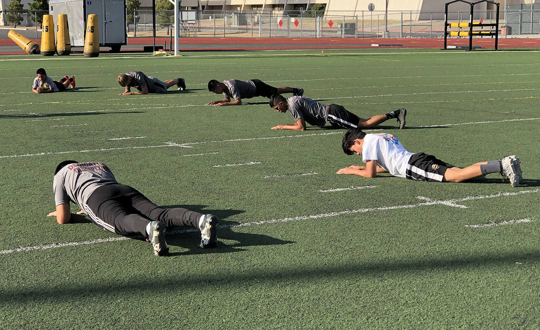 Tom Rysinski/Pahrump Valley Times Push-ups are part of the routine during conditioning drills f ...