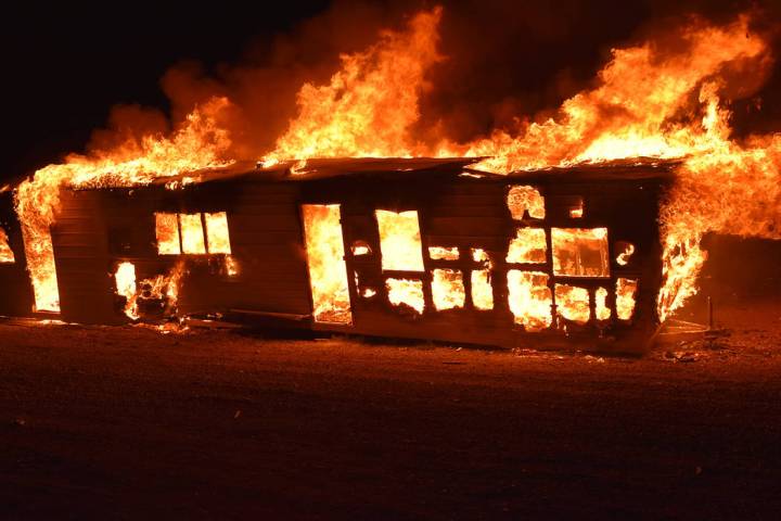 Special to the Pahrump Valley Times Fire destroyed a travel trailer in the area of Barney Stree ...