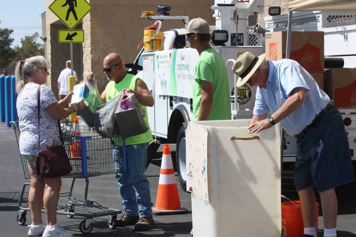 Robin Hebrock/Pahrump Valley Times An area resident is shown handing school supply donations to ...