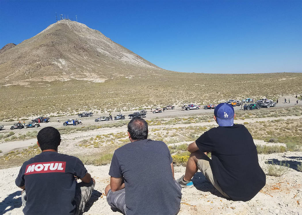 David Jacobs/Pahrump Valley Times Fans gather to watch as racers at the staging area of the sta ...