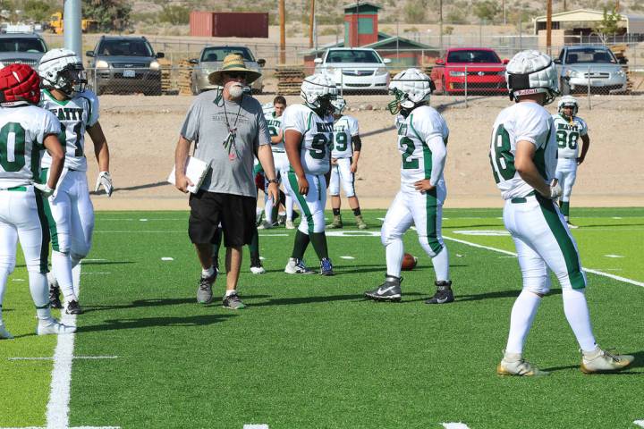 Tom Rysinski/Pahrump Valley Times Beatty High School football coach Leo Verzilli talks to his t ...