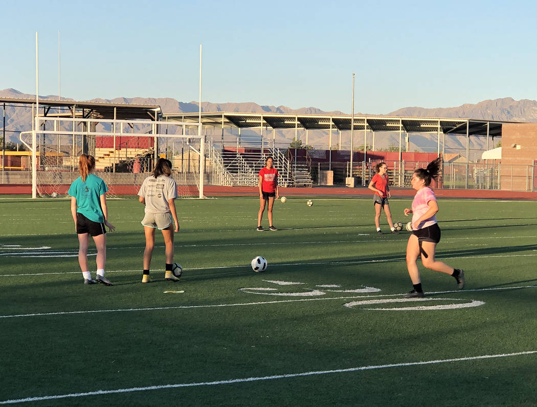 Tom Rysinski/Pahrump Valley Times Pahrump Valley High School girls soccer players at morning pr ...