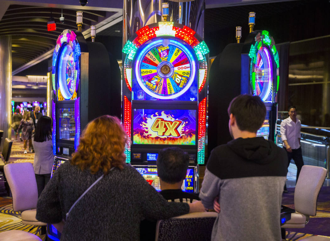 Gamblers play slots at SLS Las Vegas on Thursday, May, 30, 2019, in Las Vegas. (Benjamin Hager/ ...