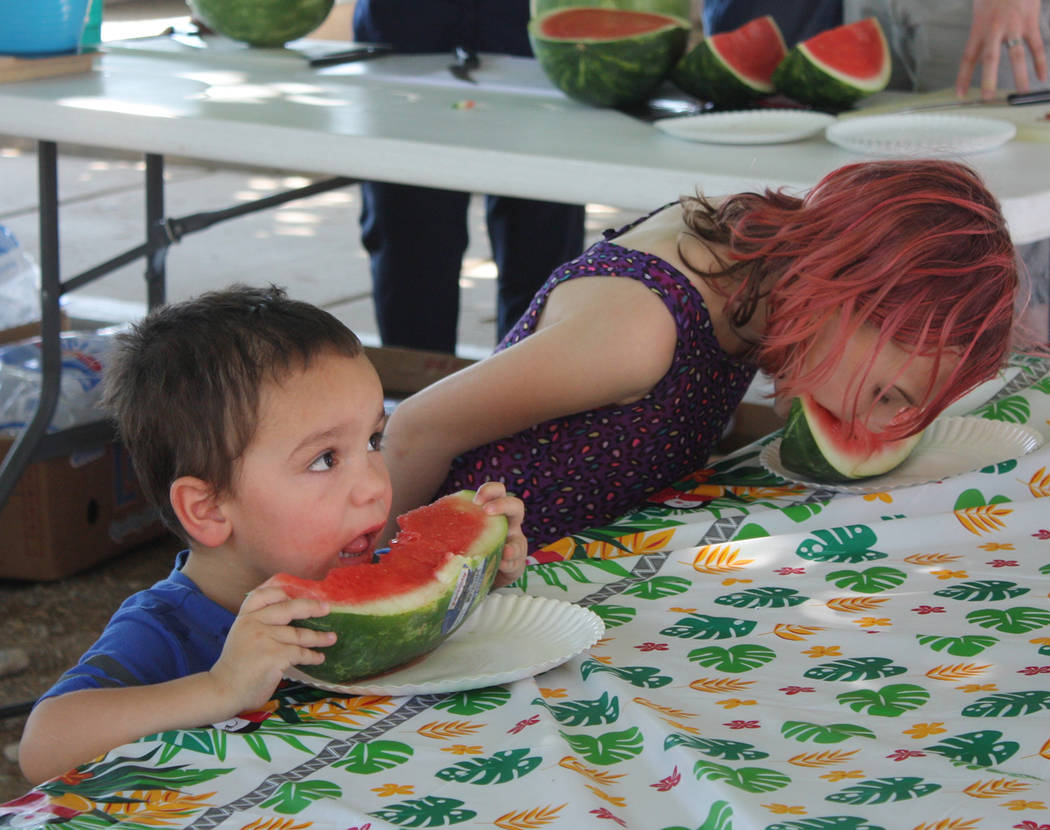 Robin Hebrock/Pahrump Valley Times Youngsters are pictured devouring cold watermelon during the ...