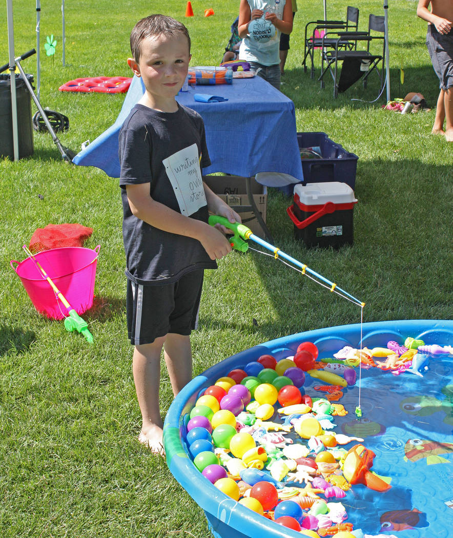 Robin Hebrock/Pahrump Valley Times A young Pioneer Celebration attendee smiles as he enjoys a f ...