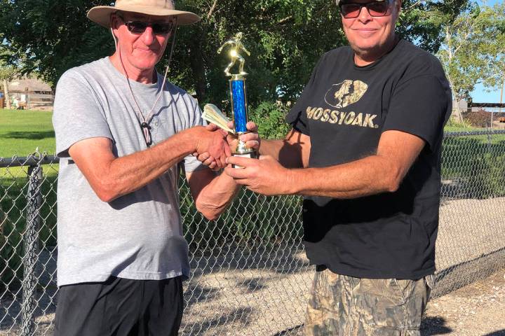 Tom Rysinski/Times-Bonanza & Goldfield News Tournament organizer Lathan Dilger, right, presents ...