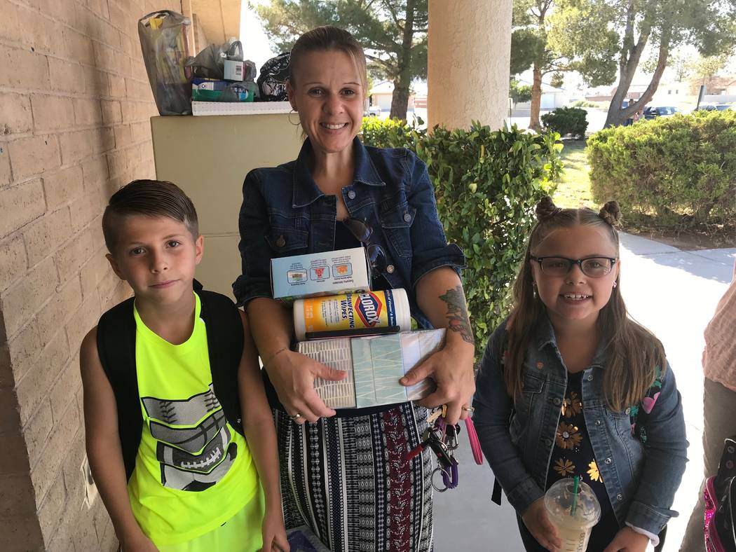 Jeffrey Meehan/Pahrump Valley Times Melissa Mevis (center) stands with her two children, Eli (l ...