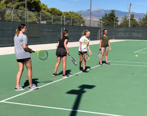 Tom Rysinski/Pahrump Valley Times The Pahrump Valley High School tennis team practices Tuesday ...