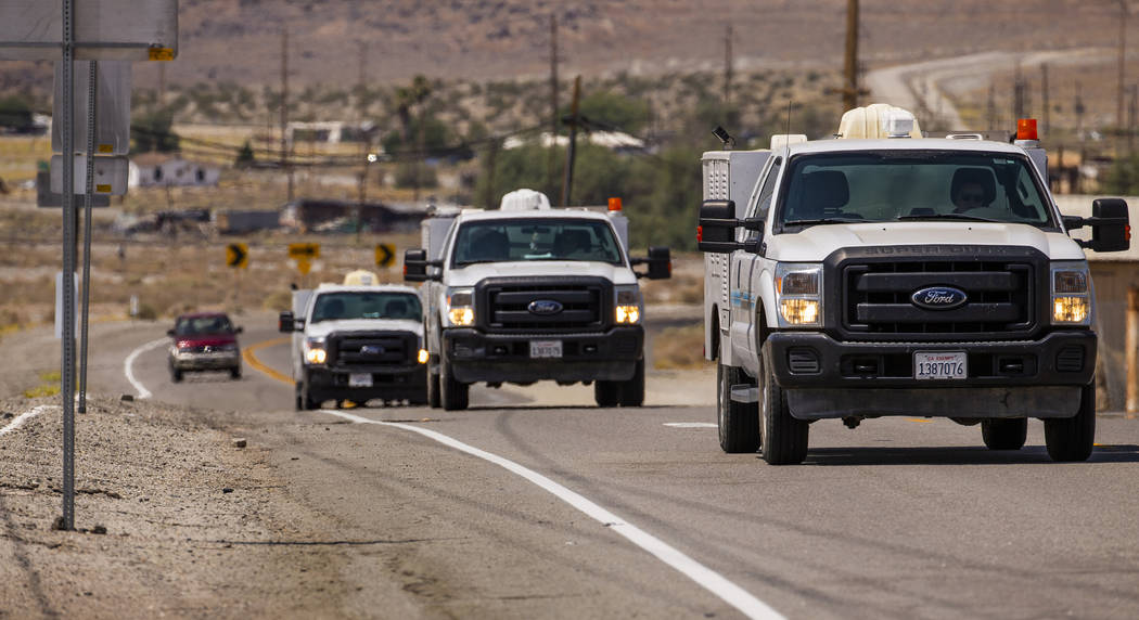 L.E. Baskow/Las Vegas Review-Journal Utility repair vehicles roll into Trona, Calif. last month ...