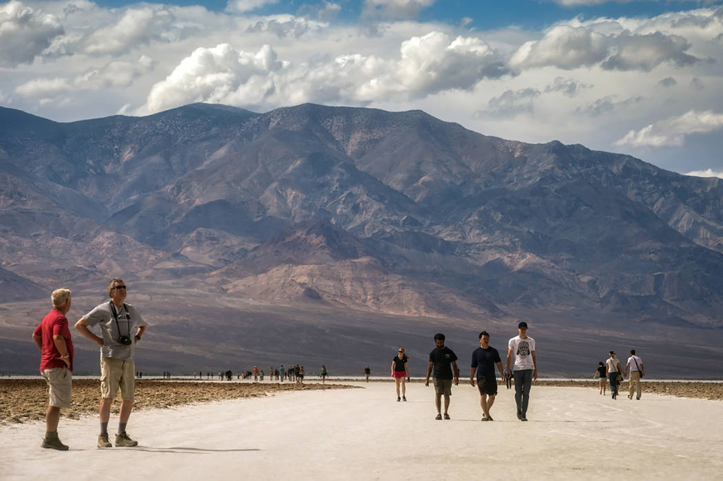 Photo courtesy of Kurt Moses Visitors explore the Badwater area of Death Valley National Park. ...