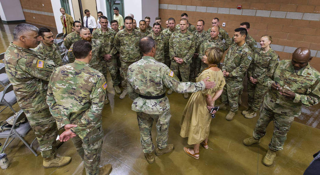Brigadier General Zach Doser, center, chats with Rep. Susie Lee and soldiers with the Nevada Ar ...
