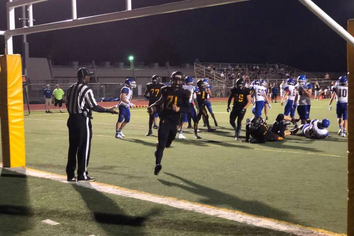 Tom Rysinski/Pahrump Valley Times Tony Margiotta scores one of his three touchdowns Friday nigh ...