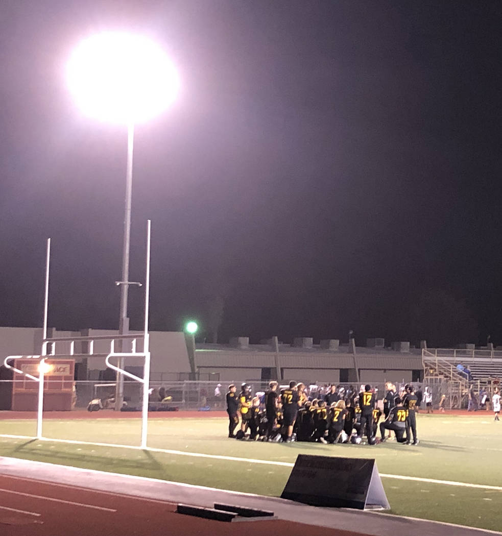 Tom Rysinski/Pahrump Valley Times Pahrump Valley High School football players gather with their ...