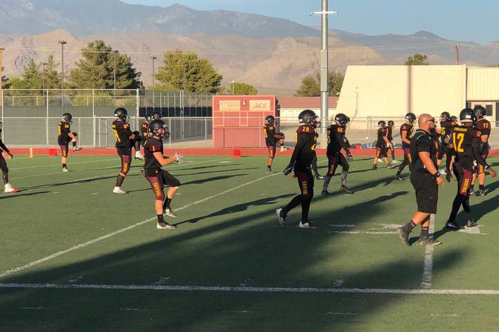 Tom Rysinski/Pahrump Valley Times Pahrump Valley High School football players stretch before Fr ...