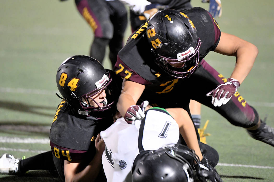 Peter Davis/Special to the Pahrump Valley Times Andrew Avena, left and Anthony Peralta tackle V ...