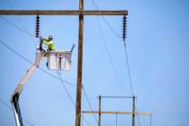 Valley Electric Association Inc. file Crews from Valley Electric Association moves three 75-foo ...