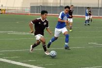 Horace Langford Jr./Pahrump Valley Times Sophomore Christopher Vega makes a run for the Pahrump ...