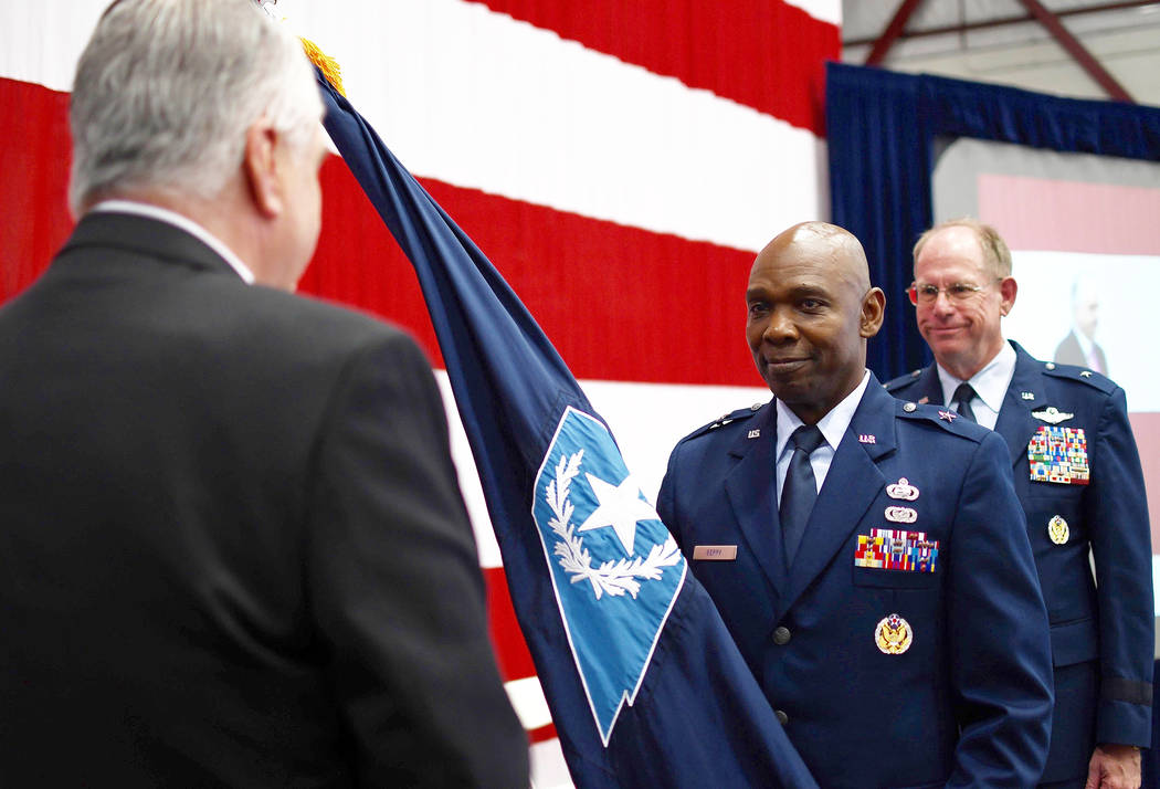 Senior Airman Baylee Belanger/Nevada National Guard Brig. Gen. Ondra Berry, center, receives c ...