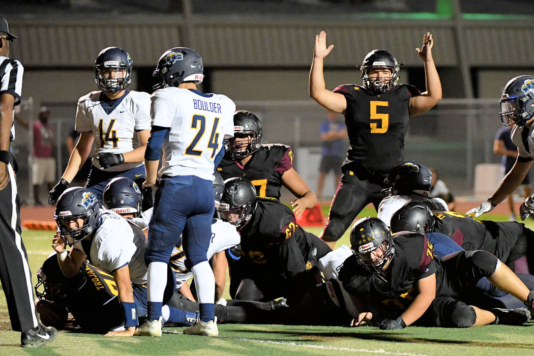 Peter Davis/Special to the Pahrump Valley Times Senior Kody Peugh signals for a touchdown on a ...