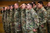 Soldiers with the Nevada Army Guard 3665th Explosive Ordnance Disposal Company salute during a ...