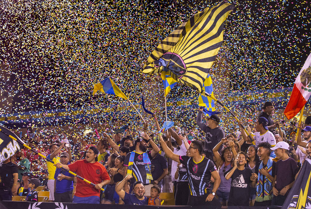 L.E. Baskow/Las Vegas Review-Journal Las Vegas Lights FC fans are bathed in confetti as the tea ...