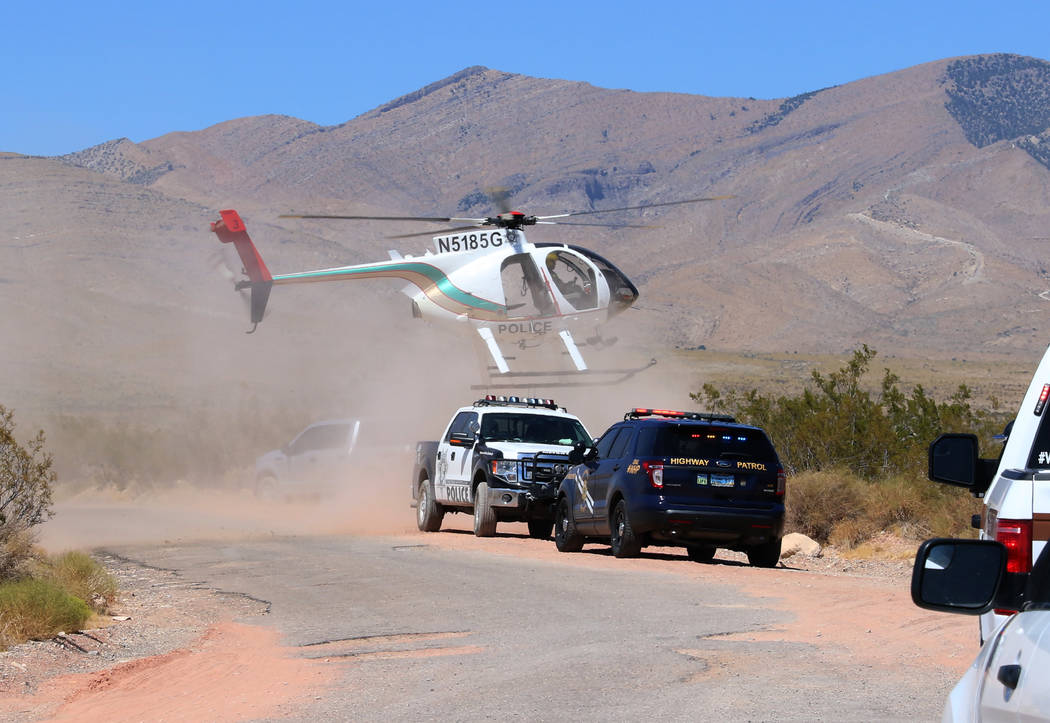 A Metropolitan Police Department helicopter lands near Goodsprings, southwest of Las Vegas, whe ...