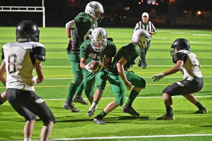 Richard Stephens/Special to the Pahrump Valley Times Senior Fabian Perez bursts through a hole ...