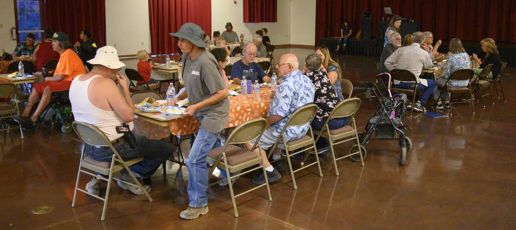 Richard Stephens/Special to the Pahrump Valley Times Residents sit at tables during the meet an ...