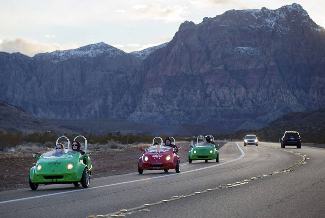 Chase Stevens/Las Vegas Review-Journal Scooter cars pass through the Red Rock Canyon National C ...