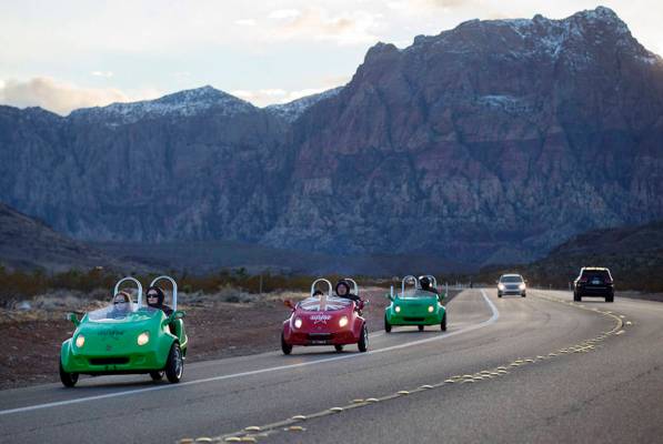 Chase Stevens/Las Vegas Review-Journal Scooter cars pass through the Red Rock Canyon National C ...