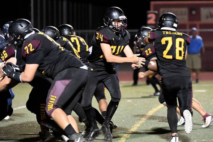 Peter Davis/Special to the Pahrump Valley Times Junior Jalen Denton, shown taking a handoff fro ...