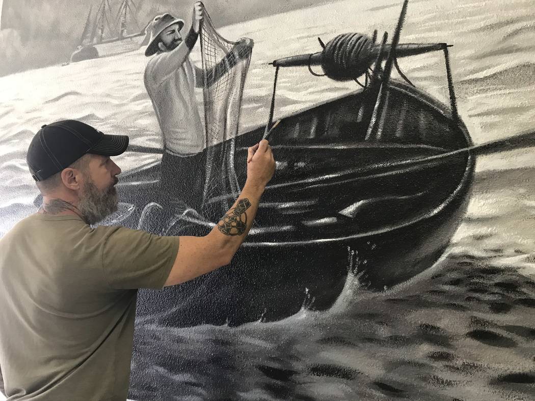 Jeffrey Meehan/Pahrump Valley Times Jerry Ragg, owner and artist at Mural Decor, paints one of ...