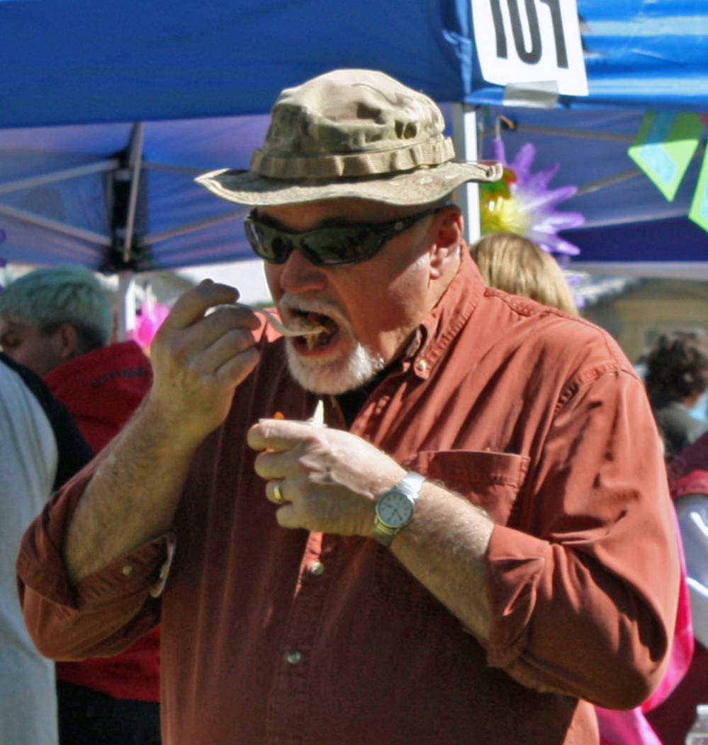 Robin Hebrock/Pahrump Valley Times A 2019 Taco Fest patron digs into one of the many taco samp ...