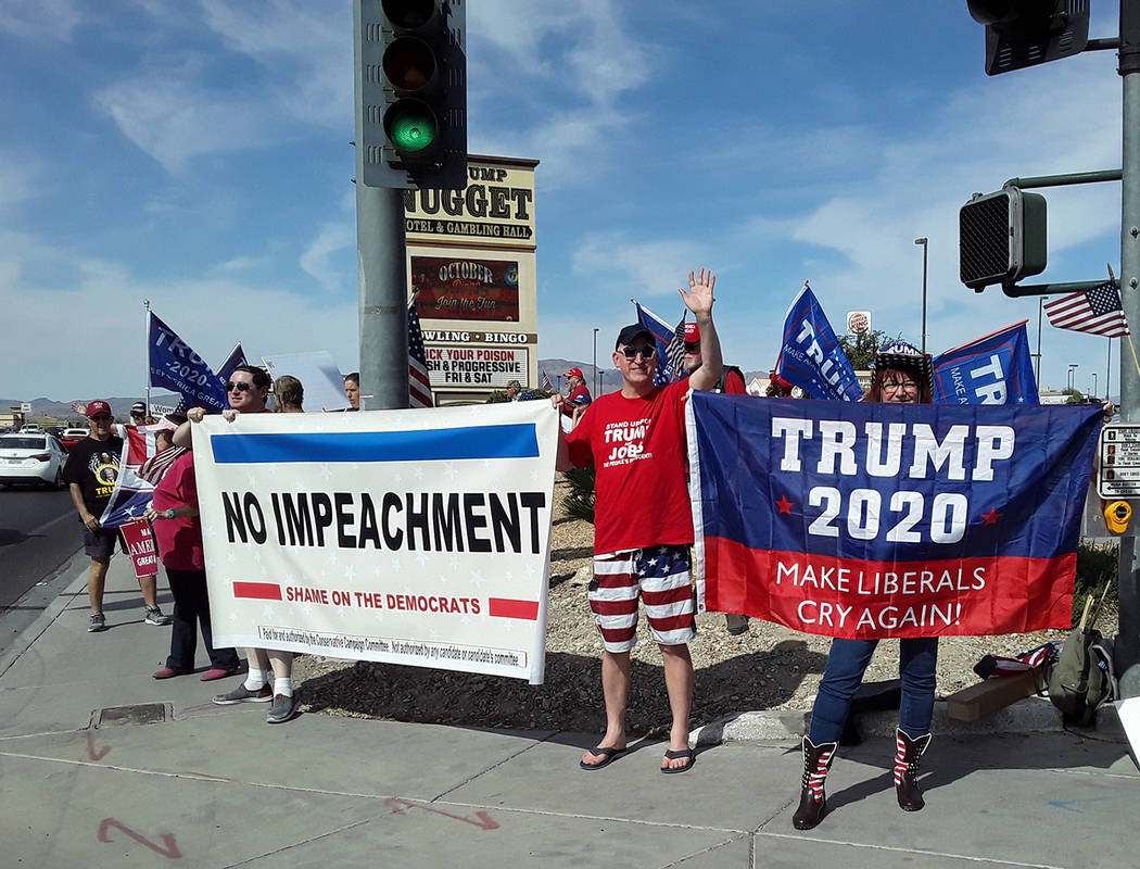 Selwyn Harris/Pahrump Valley Times Several dozen supporters of President Trump gathered at the ...