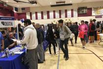 Jeffrey Meehan/Pahrump Valley Times Students make their way through the line of employers, univ ...