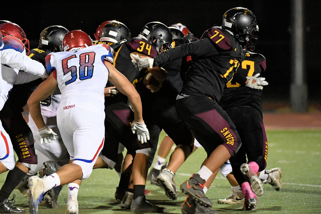 Peter Davis/Special to the Pahrump Valley Times A phalanx of Pahrump Valley blockers protects s ...