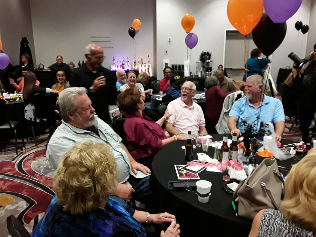 Selwyn Harris/Pahrump Valley Times Dick Duffin, center, reacts to his $10,000 windfall toward t ...