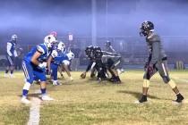 Justin Emerson/Las Vegas Review-Journal Moapa Valley football players, left, line up against Ch ...