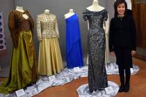 Guy Clifton/Travel Nevada Nevada first lady Kathy Sisolak stands next to the inaugural gown she ...